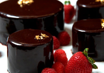 Chocolate celebration cakes with fresh strawberries